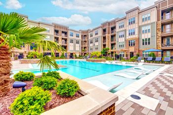 Artesia big creek pool with lounge chairs